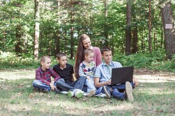 mother with children on a picnic in nature