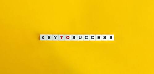 Key to Success Idiom and Banner. Letter Tiles on Yellow Background. Minimal Aesthetics.