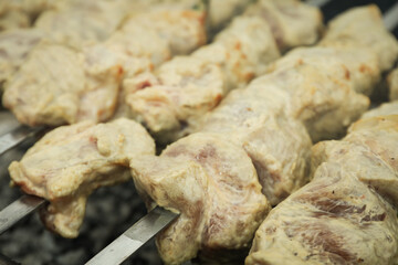 Tasty shashlik is fried on charcoal outdoor