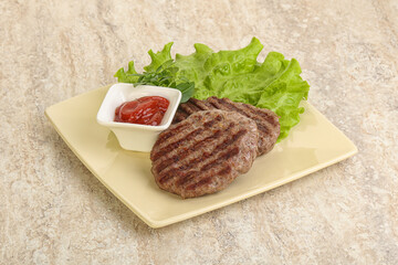 Grilled beef burger cutlet with sauce