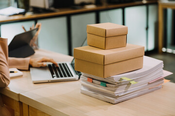 Portrait of Starting small businesses SME owners, two Asian woman check online orders Selling products working with boxs freelance work at home office, sme business online small medium enterprise