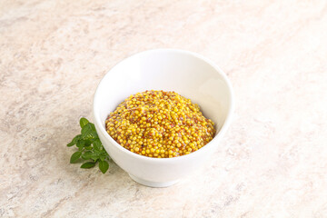 Grain mustard sauce in the bowl