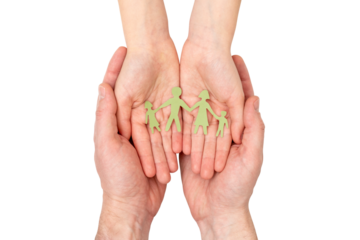 Father and daughter holding paper family cutout in cupped hands