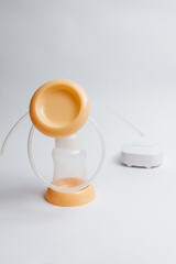 Background of automatic breast pump, baby bottle for milk. Mother's breast milk is the healthiest food for a newborn