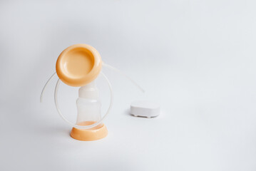 Background of automatic breast pump, baby bottle for milk. Mother's breast milk is the healthiest food for a newborn