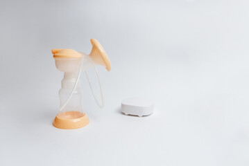 Background of automatic breast pump, baby bottle for milk. Mother's breast milk is the healthiest food for a newborn