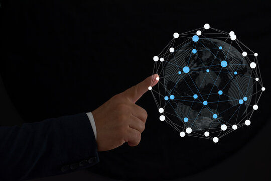 Digital composite image of businessman touching phone over illuminated world globe with connections