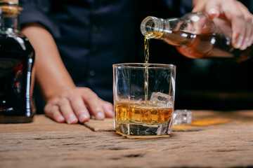 Barman pouring whiskey whiskey glass beautiful night