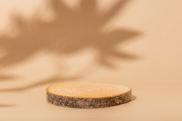 Minimal modern product display on beige background. Wood slice podium. Concept scene stage showcase for new product, promotion sale, banner, presentation, cosmetic