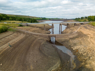 An old bridge is revealed during at Baitings Reservoir during one of the hottest summers in record UK 2022