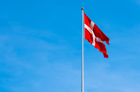Danish National flag, Dannebrog on a flagpole.