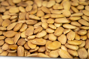 Roasted peeled almonds nuts, tasty healthy vegetarian food