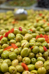 Assortment of pickled green olives on farmers market in Malaga, Andalusia, Spain