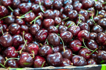 Fresh ripe sweet cherry berries on market