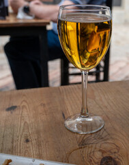 Fresh draught lager beer is glass served in outdoor cafe