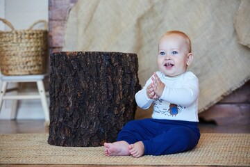 Naklejka premium A small newborn baby boy. The concept of childhood