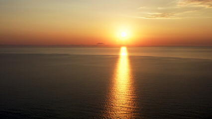 Stunning sunrise over calm ocean