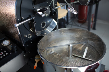 Coffee roaster machine at coffee roasting process.