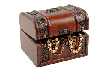 Antique wooden carved chest filled with ornaments isolated on white background.