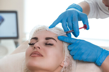 Forehead Augmentation and Correction Procedure in Cosmetology Salon While Specialist Accomplishing...