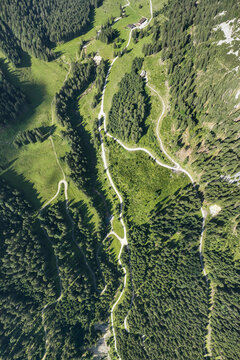 bird's-eye view of the musauer alm with lush green meadows, forests and winding hiking trails in beautiful tyrol