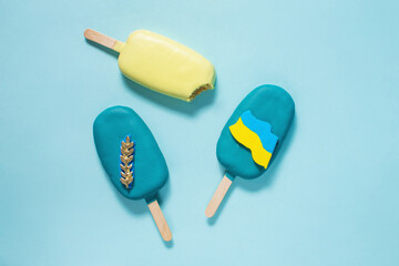 Eskimo cake. Ice cream on stick with blue and yellow chocolate. Ukraine patriotic concept, national emblem and flag