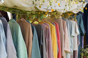 Organic eco clothes on a hanger. Home-made clothing from natural and processed fabrics, natural...