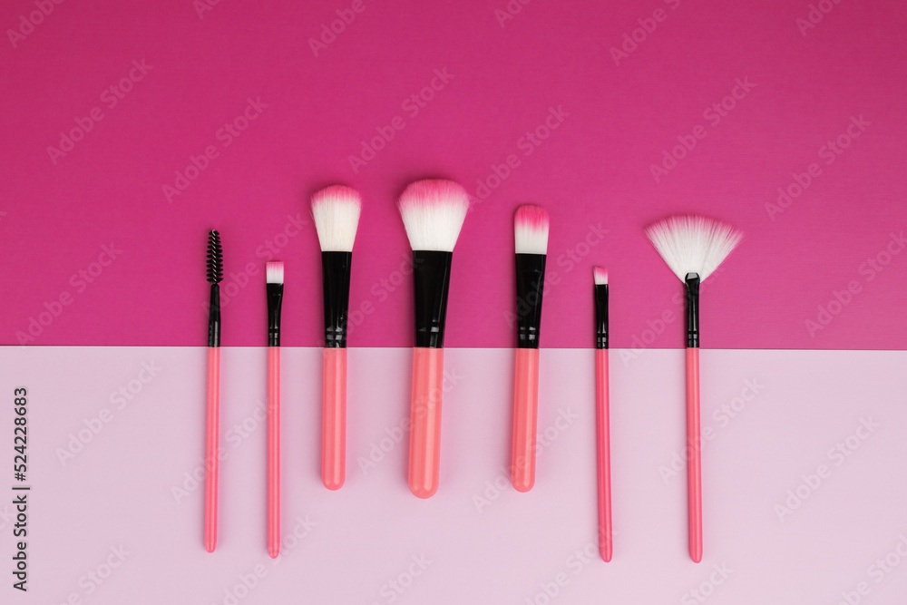 Wall mural makeup brushes, beauty and fashion, decorative cosmetics on pink bright and pastel background