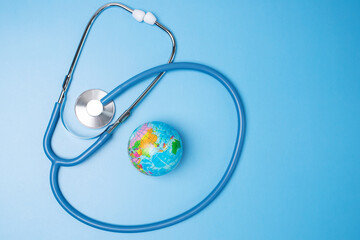 earth day, day protection global environment, world planet earth save, globe planet and stethoscope on blue background