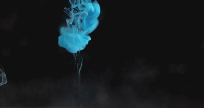 Blue color ink drop in water. Slow Movement background liquid and smoke dynamic blend