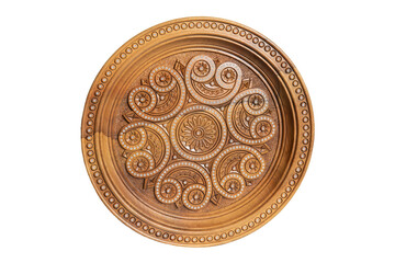 Isolated on white wooden souvenir plate with carved and decorated ornament