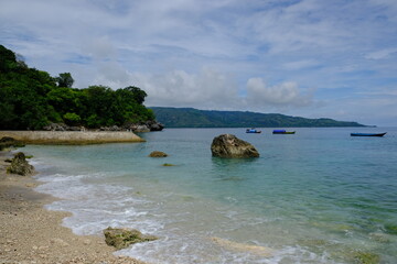 Indonesia Alor Island - Coastline landscape wit beach and fishing boats