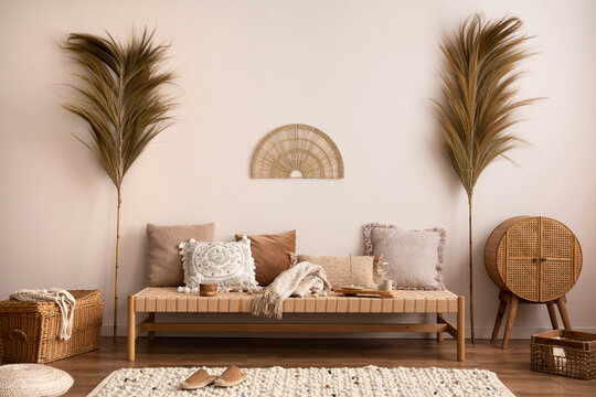 Boho And Cozy Interior Of Meditation Room With Beige Chaise Lounge, Carpet, Rattan Commode, Pillows, Side Table, Decoration, Books, Carpet And Personal Accessories. Warm Home Decor. Template.	
