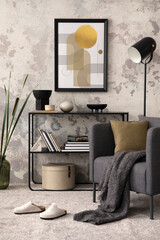 The stylish composition of living room interior with gray armchair with plaid and pillow, carpet, coffee table, commode and personal accessories. Gray concrete wall. Mock up poster frame. Template.	