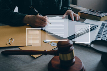 Male lawyer working with contract papers and wooden gavel on tabel in courtroom. justice and law ,attorney, court judge, concept. © ARMMY PICCA