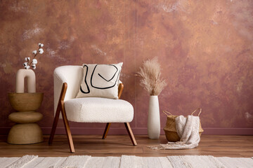 Minimalist composition of aesthetic and elegant room with white boucle armchair, vase with dried...