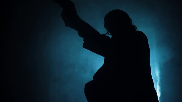 Cinematic shot of a serial killer in a suit coming out of the door and shooting with smoke and dramatic lighting. 
