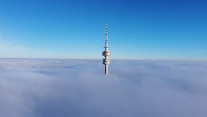 Olympic Tower of munich over fog