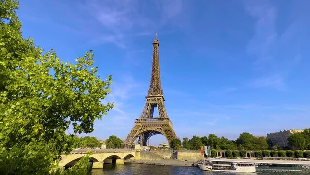Eiffel Tower at sunset in summer. Neutral color video for edit. Most popular tourist landmark in France. Beautiful French tower at Champ de Mars, 5 Avenue Anatole France