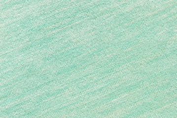 Soft light green melange jersey fabric texture or background