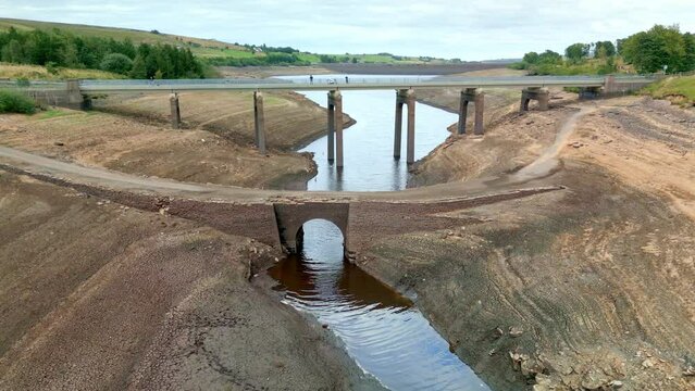 An old bridge is revealed during at Baitings Reservoir during one of the hottest summers in record UK 2022