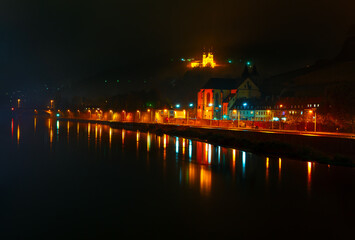Wurzburg Germany in the night . Main river in the nighttime . Night city reflection in the water 