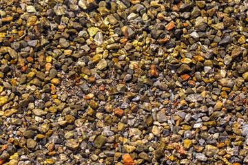 Colorful stones background in the sea