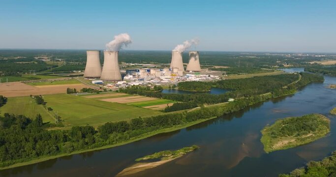 View of drone of nuclear power plant and river. Aerial panoramic flight of around the nuclear power plant.
