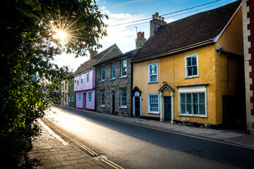 Sun shining along typical street of Sudbury in Suffolk