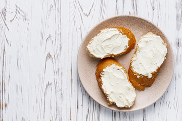 baguette cream cheese sandwich on a white background