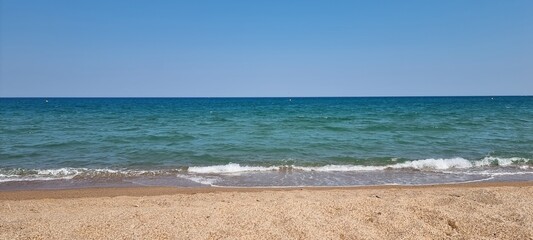 Pals Spain July 2022 lonely beach and the sea against blue sky