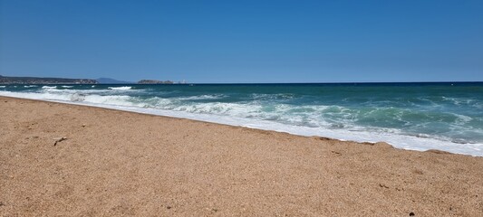 Pals, Costa Brava, Spain July 2022, beach and sea against blue sky with Illes Medes in beautiful weather
