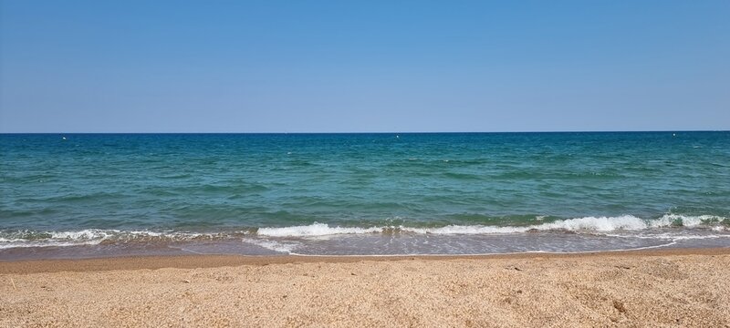 Pals Spain July 2022 lonely beach and the sea against blue sky