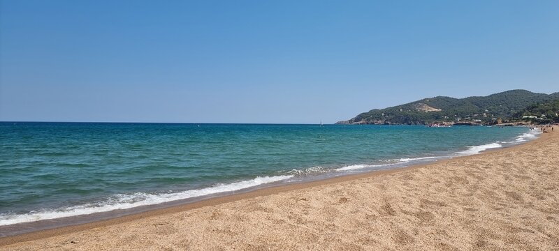 Pals Spain July 2022 lonely beach and the sea against blue sky
